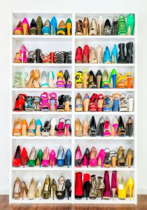 A Shoe Closet (wardrobe) with lots of colorfull High Heels shoes.
