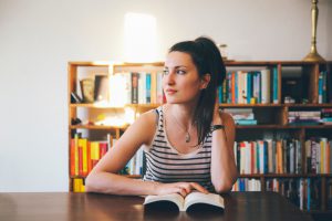 Young woman reading at home